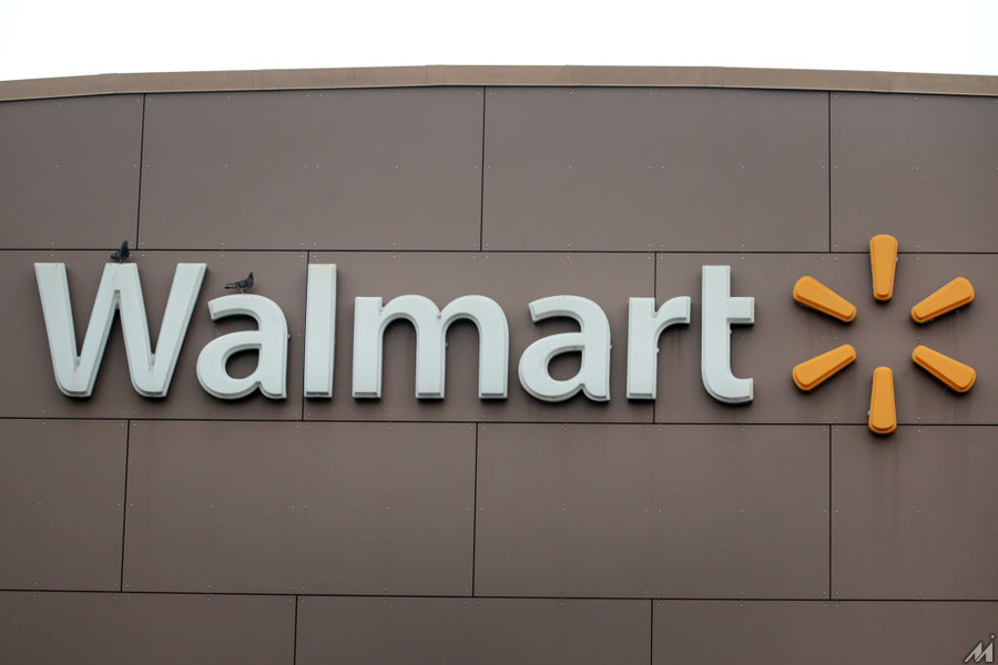 <p>CHICAGO, ILLINOIS – MAY 19: A sign hangs outside of a Walmart store on May 19, 2020 in Chicago, Illinois. Walmart reported a 74% increase in U.S. online sales for the quarter that ended April 30, and a 10% increase in same store sales for the same period as the effects of the coronavirus helped to boost sales. (Photo by Scott Olson/Getty Images)</p>