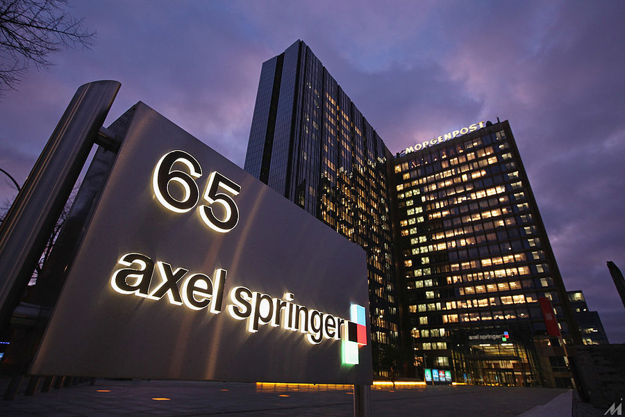 <p>BERLIN, GERMANY – JANUARY 06:  The corporate headquarters of Axel Springer Verlag publishing house, which includes Germany’s biggest tabloid newspaper, Bild Zeitung, stands illuminated on January 6, 2011 in Berlin, Germany. Bild Zeitung Editor-in-Chief Kai Diekmann and German President Chistian Wulff are locked into a war of words over a message Wulff left on Diekmann’s mobile phone in which he reportedly demanded that Bild not publish a compromising story about Wulff’s personal financial conduct while governor of Lower Saxony. In a recent television interview Wulff claimed he only asked Diekmann to postpone publication of the story by a day.  (Photo by Sean Gallup/Getty Images)</p>