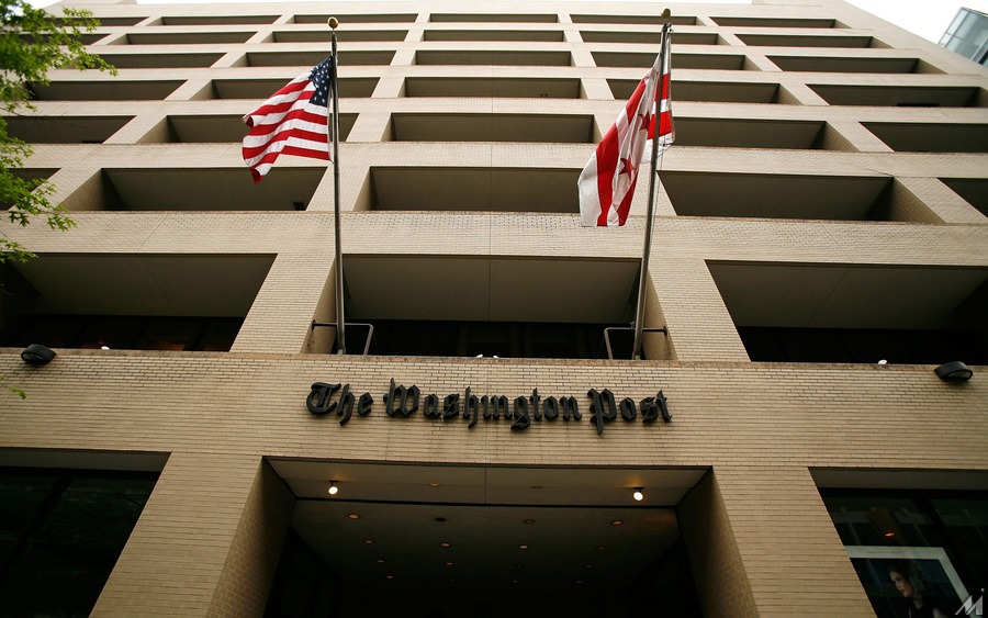 <p>WASHINGTON – MAY 01:  Flags wave in front of the Washington Post building on May 1, 2009 in Washington, DC. The newspaper has announced its first quarter earnings with a net loss of $19.5 million.  (Photo by Alex Wong/Getty Images)</p>