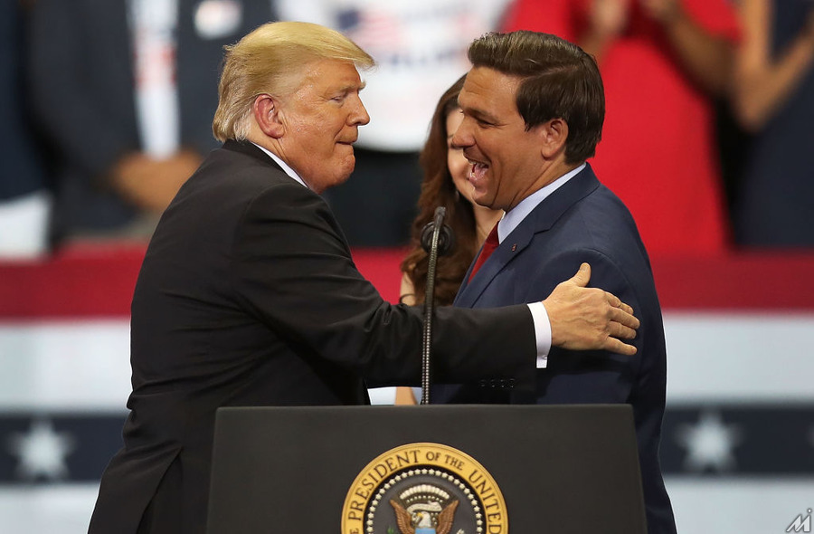 <p>ESTERO, FL – OCTOBER 31:  President Donald Trump greets Florida Republican gubernatorial candidate Ron DeSantis during a campaign rally at the Hertz Arena on October 31, 2018 in Estero, Florida. President Trump continues traveling across America to help get the vote out for Republican candidates running for office.  (Photo by Joe Raedle/Getty Images)</p>