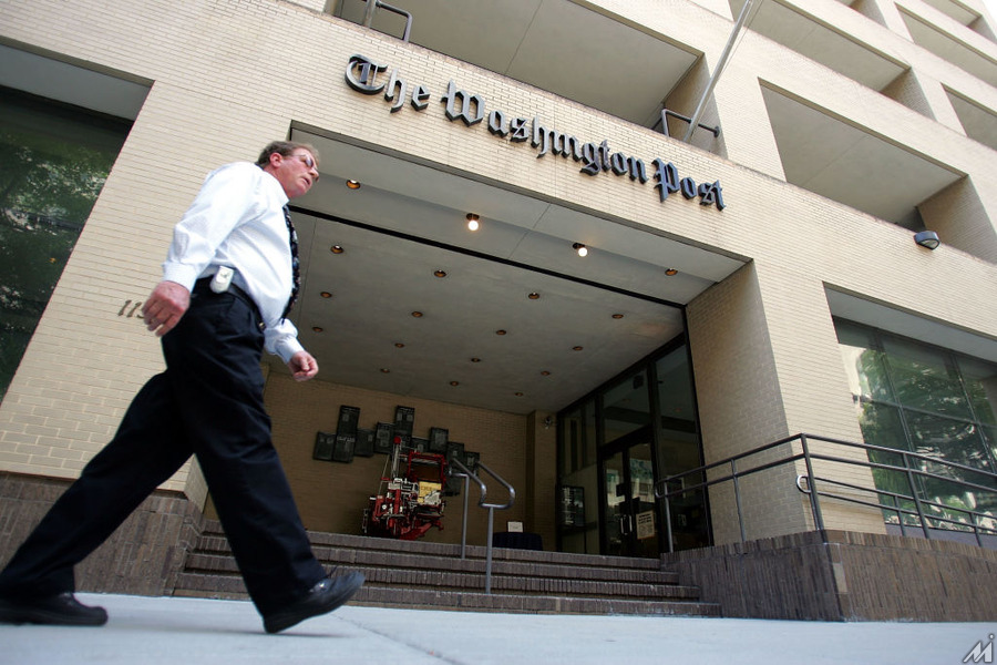 <p>WASHINGTON – MAY 31: A man walks past The Washington Post building May 31, 2005 in Washington, DC. The current edition of Vanity Fair reports that retired FBI official Mark Felt was the “Deep Throat” source who spoke to two Washington Post reporters about the Watergate scandal that forced President Richard Nixon to resign in 1974.  (Photo by Joe Raedle/Getty Images)</p>