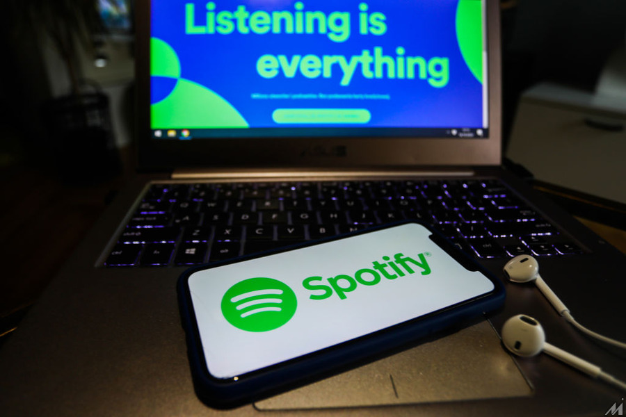<p>Spotify logo displayed on a phone screen and Spotify website displayed on a laptop screen are seen in this illustration photo taken in Poland on October 18, 2020.<br /> (Photo Illustration by Jakub Porzycki/NurPhoto via Getty Images)</p>