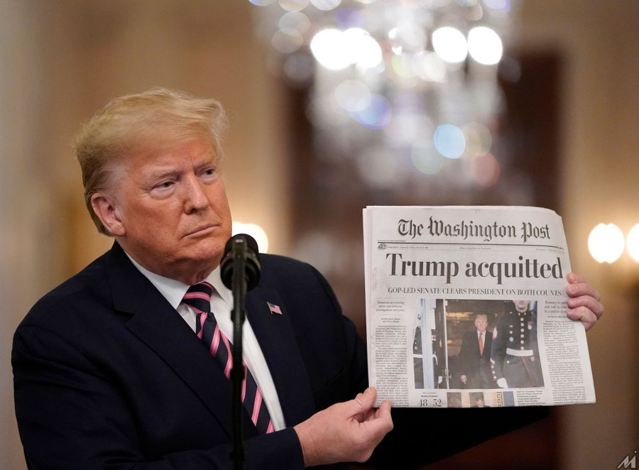 <p>WASHINGTON, DC – FEBRUARY 06:  U.S. President Donald Trump holds a copy of The Washington Post as he speaks in the East Room of the White House one day after the U.S. Senate acquitted on two articles of impeachment, ion February 6, 2020 in Washington, DC. After five months of congressional hearings and investigations about President Trump’s dealings with Ukraine, the U.S. Senate formally acquitted the president on Wednesday of charges that he abused his power and obstructed Congress. (Photo by Drew Angerer/Getty Images)</p>