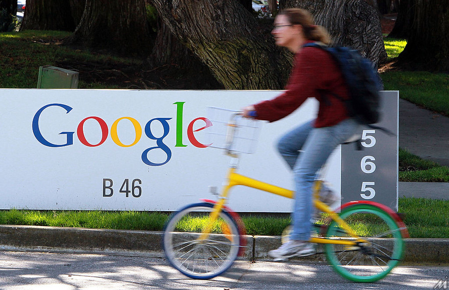 <p>MOUNTAIN VIEW, CA – MARCH 10:  A bicyclist rides by a sign at the Google headquarters March 10, 2010 in Mountain View, California. Google announced today that they are adding bicycle routes to their popular Google Maps and is available in 150 U.S. cities. (Photo by Justin Sullivan/Getty Images)</p>